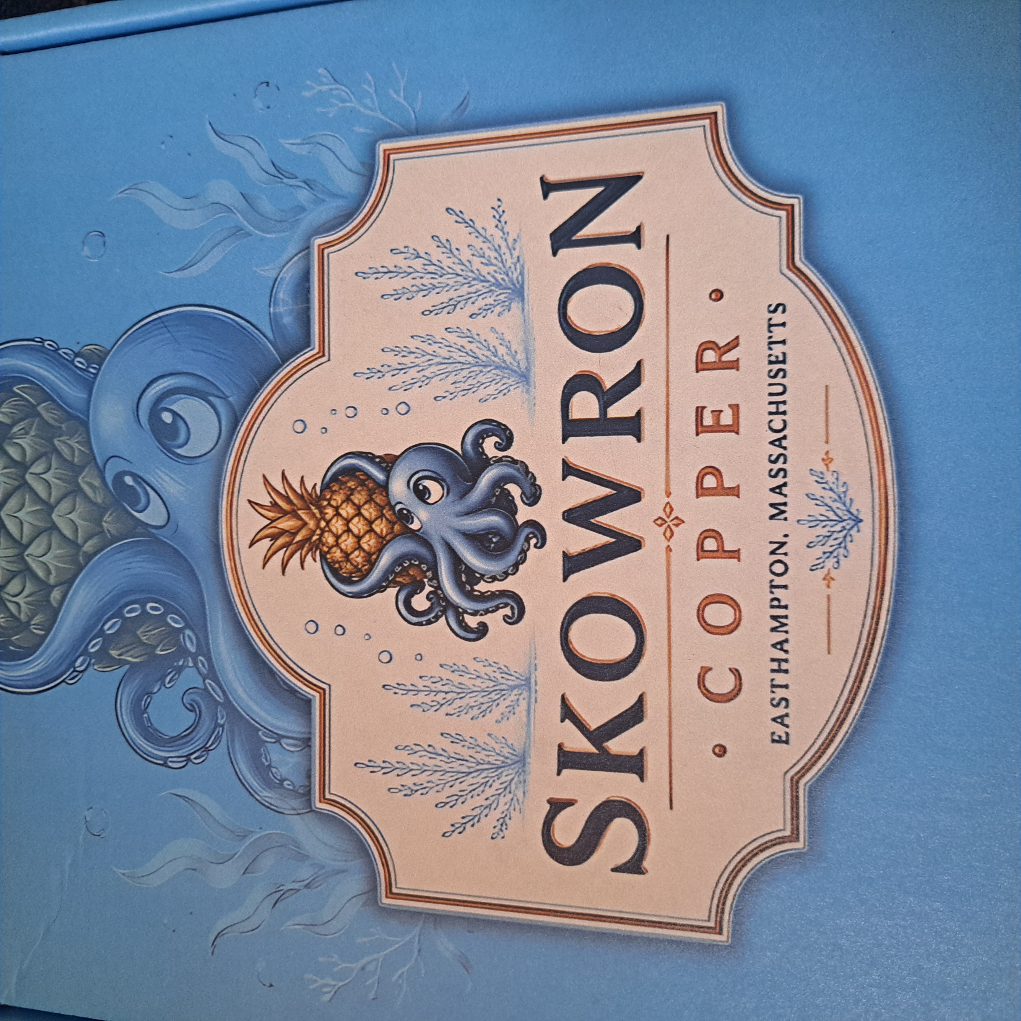 Skowron Copper brand label with octopus and pineapple illustration